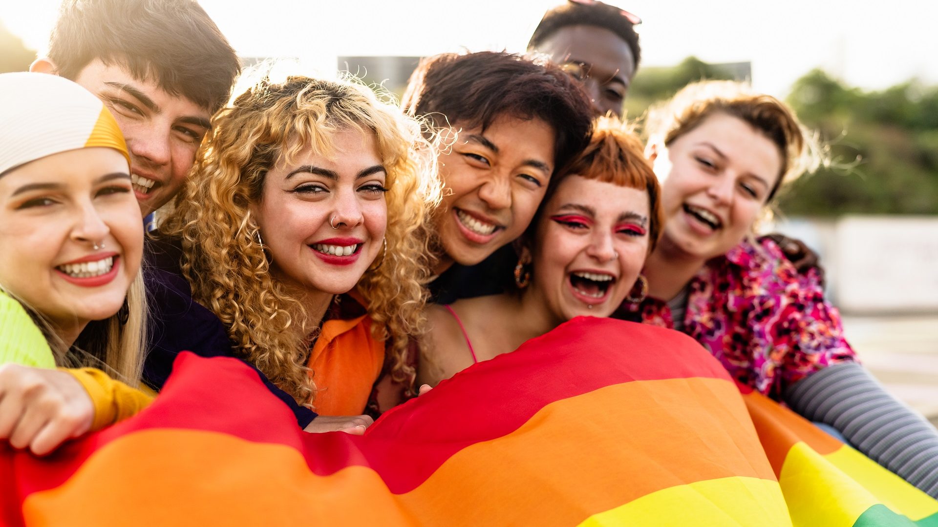 Diverse young friends celebrating gay pride festival - LGBTQ community concept
